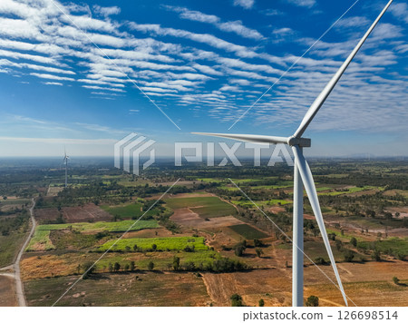 Wind energy and sustainable power generation with wind turbines, Eco-friendly solutions for renewable resources. Wind power farm and sustainable development of renewable energy, green technology. 126698514