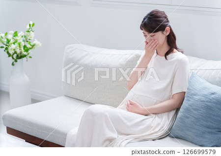 Young pregnant woman with morning sickness in late pregnancy Young pregnant woman with morning sickness in late pregnancy 126699579