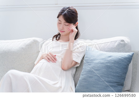 Depressed young pregnant woman Depressed young pregnant woman 126699580