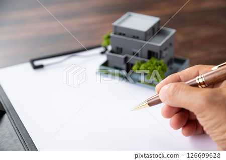 House, binder and pen 126699628