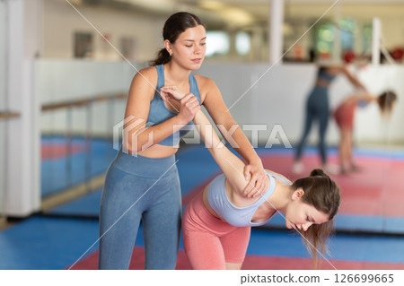 Women practicing gifts in self-defense training 126699665