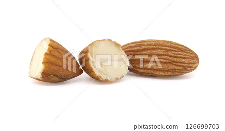 Three almonds, one whole and two broken, arranged on a clean, bright white backdrop. 126699703