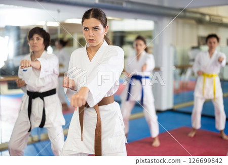 Female athletes standing in formation, kata starting position 126699842
