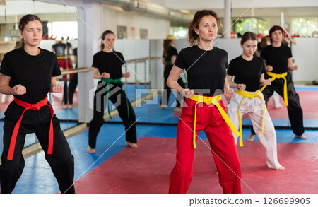 Group of women training karate techniques in studio 126699905