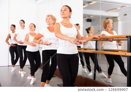 Group of women doing ballet dance moves 126699907