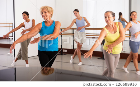 Positive women of different ages dancing strip plastic in dance class 126699910
