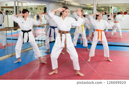 Female athletes standing in formation, kata starting position 126699920