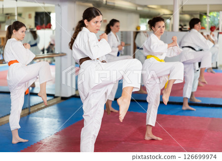Women practice karate strikes 126699974
