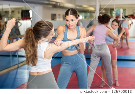 Women and girls in self-defense class Women and girls in self-defense class 126700018
