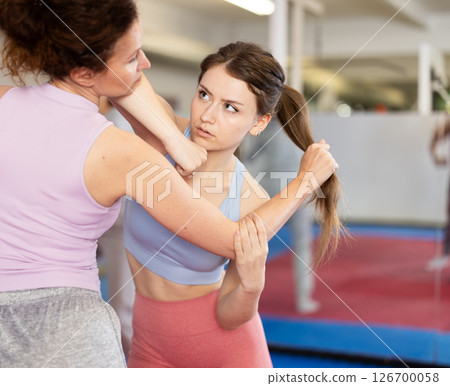Women and girls in self-defense class Women and girls in self-defense class 126700058