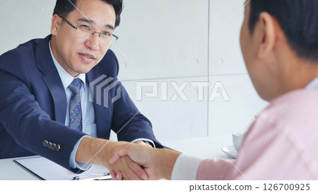 Businessman handshake manager recruitment team business. Partners shaking hands together greeting mergers and acquisitions. Shakehand Teamwork Partnership in office meeting room. Business concept Businessman handshake manager recruitment team business. Partners shaking hands together greeting mergers and acquisitions. Shakehand Teamwork Partnership in office meeting room. Business concept 126700925