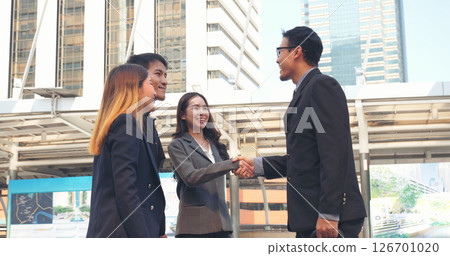 Diversity Business Partner meeting trust in teamwork and partnership businessman, businesswoman talking together in modern city. Asian coworker team meeting with Business People Working Together Team Diversity Business Partner meeting trust in teamwork and partnership businessman, businesswoman talking together in modern city. Asian coworker team meeting with Business People Working Together Team 126701020