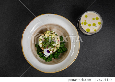 Cold summer soup okroshka. Light soup in a white bowl. Cold summer soup okroshka. Light soup in a white bowl. 126701122