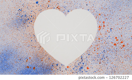 Abstract heart-shaped stencil with splattered blue and orange spray paint background. \Perfect for backgrounds, greeting cards, or artistic posters. 126702227