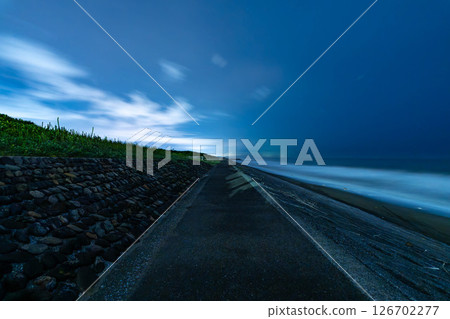 View of the sea at night from the coast 126702277