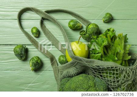 Set of protein vegetables in bag on green wooden background, top view Set of protein vegetables in bag on green wooden background, top view 126702736