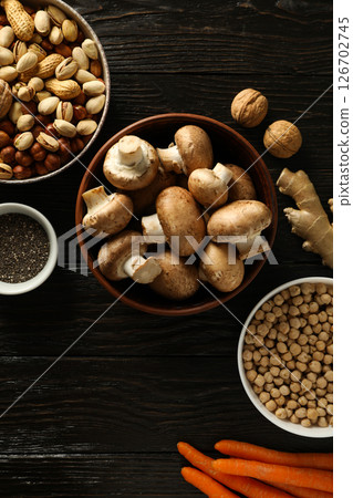 Set of vegan protein products on dark wooden background, top view Set of vegan protein products on dark wooden background, top view 126702745