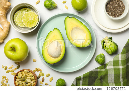 Protein vegetables and seeds on marble background, top view Protein vegetables and seeds on marble background, top view 126702751