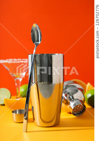 Metal shaker with fresh lime and glass Metal shaker with fresh lime and glass 126702776