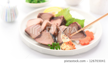 Sliced dried bonito (on a white background) Sliced dried bonito (on a white background) 126703041