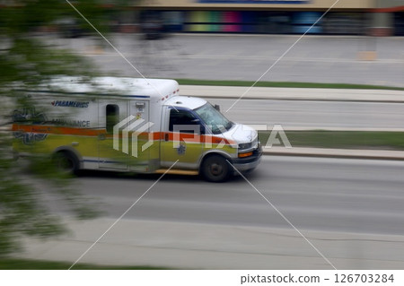 Ambulance car on the road, blurred background 126703284