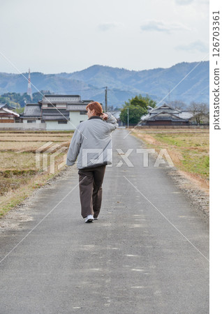 Woman gazing into the distance in nature Woman gazing into the distance in nature 126703361