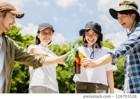 Camping: Men and women toasting 126703526