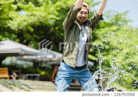 Man playing in the river 126703568
