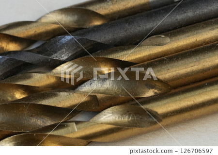Close-Up of Gold and Black Metal Drill Bits 126706597