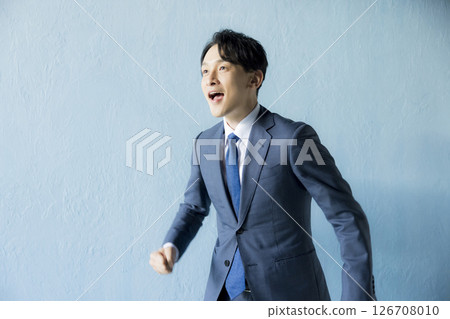 Running businessman 126708010