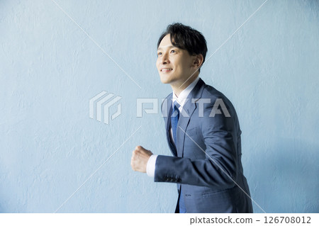 Running businessman 126708012