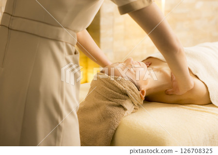 Senior woman receiving massage at beauty salon Senior woman receiving massage at beauty salon 126708325