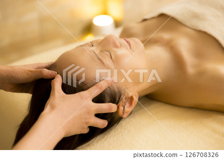 Senior woman receiving massage at beauty salon Senior woman receiving massage at beauty salon 126708326