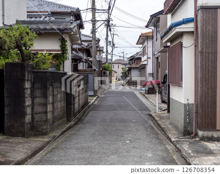 Narrow road in a densely populated area Narrow road in a densely populated area 126708354