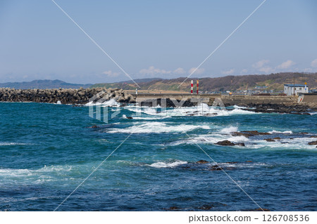 Waves lapping on the rocks and breakwater of Cape Golden Waves lapping on the rocks and breakwater of Cape Golden 126708536