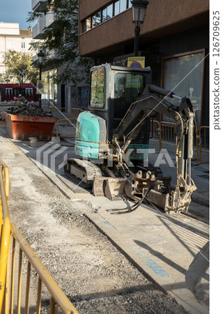 Repair of the sidewalk on the street of the city 126709625