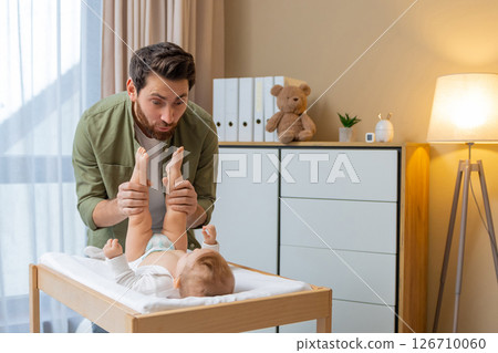 Happy young father playing with his little baby boy 126710060