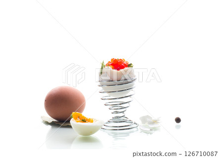 Breakfast with red caviar and boiled egg, isolated on white background Breakfast with red caviar and boiled egg, isolated on white background 126710087