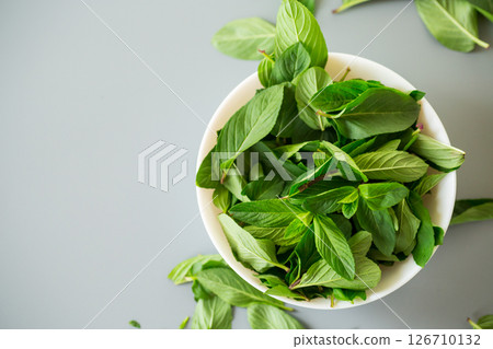 Composition with fresh mint on gray surface from above Composition with fresh mint on gray surface from above 126710132