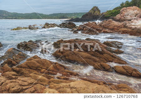 Landscape with rocks and stones by the sea. Panorama of Da Da reef or Ganh Da Dia in Phu Yen province in Vietnam 126710768