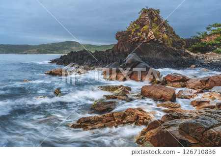 Da Dia reef in Vietnam. Panoramic landscape with volcanic basalt columns Ganh Da Dia on the beach by the sea in the Phu Yen province 126710836
