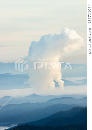 Landscape of Morning Mist with Mountain Layer. mountain ridge and clouds in rural jungle bush forest Landscape of Morning Mist with Mountain Layer. mountain ridge and clouds in rural jungle bush forest 126711064