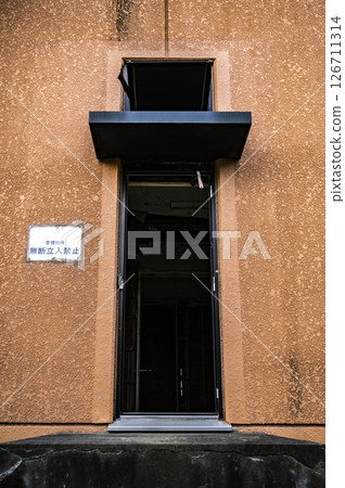 No unauthorized entry - The entrance to a building where time has stopped 126711314