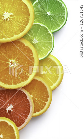 Vibrant citrus slices aligned in color transition. Clean gradient from orange to lime. Minimal, fresh, and summer-ready 126711545