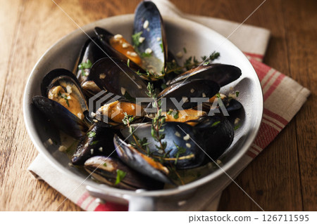 Mussels steamed in herbs and wine Mussels steamed in herbs and wine 126711595
