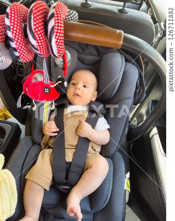 Baby in Car Seat with Colorful Toy Baby in Car Seat with Colorful Toy 126711882
