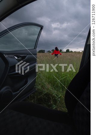 Person in Red Jacket Standing in Field Person in Red Jacket Standing in Field 126711900