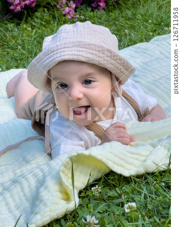 Joyful Baby Playing Outdoors 126711958