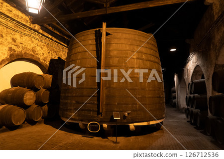 Barrels in wine cellar 126712536