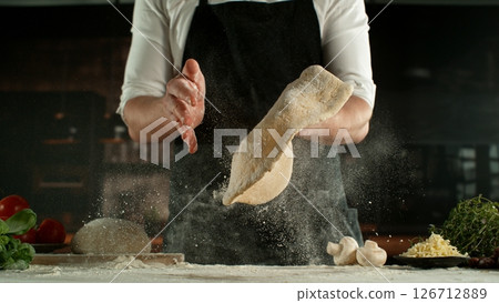 Freeze Motion of Chef Making Yeast Dough . Closeup of Bread or Pizza Dough Preparation Freeze Motion of Chef Making Yeast Dough . Closeup of Bread or Pizza Dough Preparation 126712889